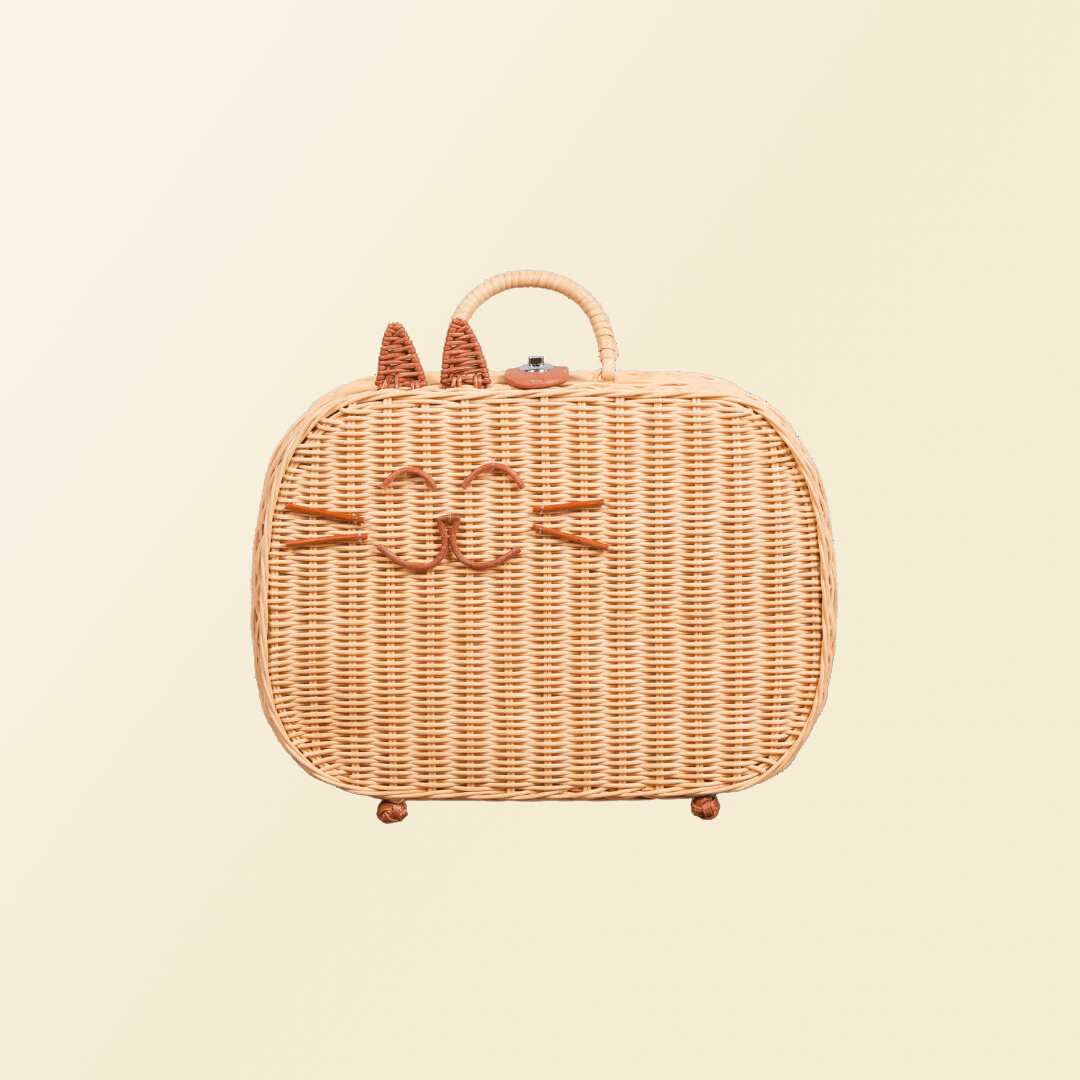 Front view of the handcrafted rattan wicker Kitty Kids Suitcase by MOMIJI, featuring playful cat face design with ears.