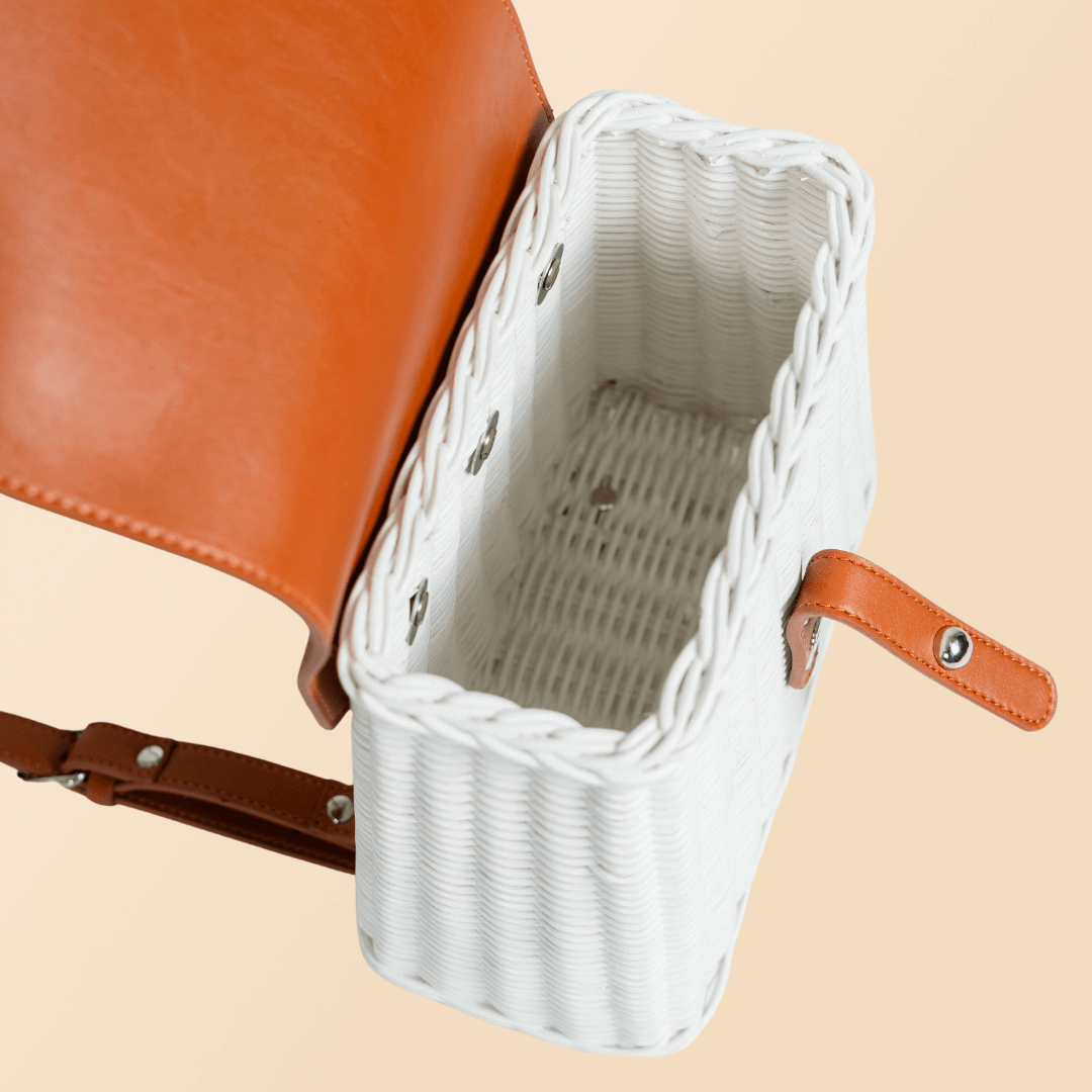 Inside view of the handcrafted rattan Layla Backpack by MOMIJI, showing compact storage space.