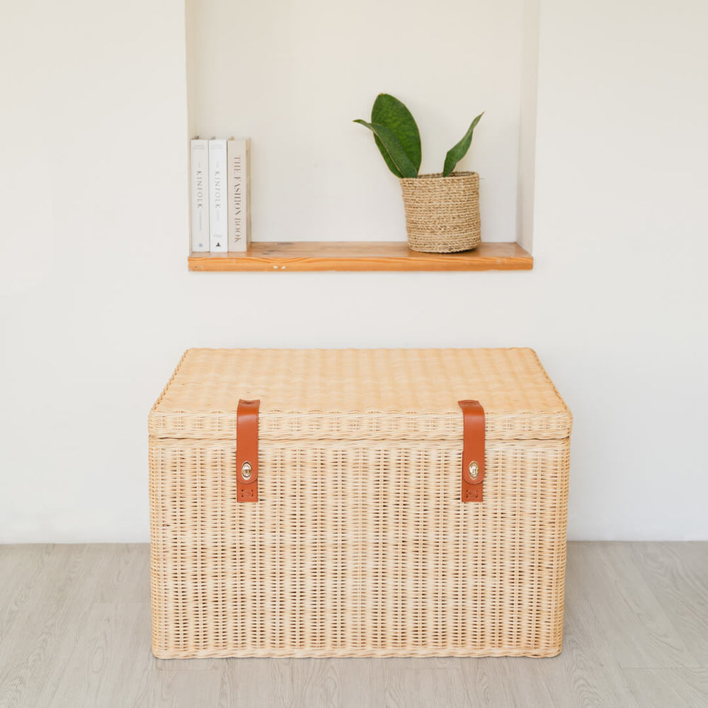 Front view of the handcrafted rattan wicker Leon Leather Trunk by MOMIJI, featuring a structured design with front lock system for secure kids storage.