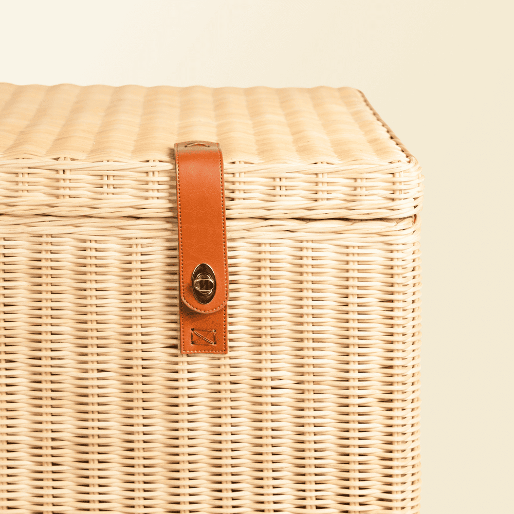 Close-up of the lock detail on the handcrafted rattan wicker Leon Leather Trunk by MOMIJI.