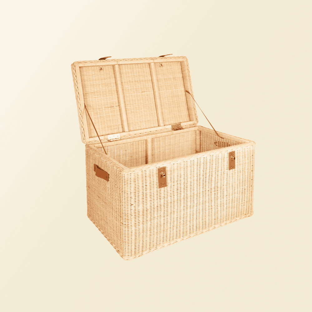 Angled open view of the handcrafted rattan wicker Leon Leather Trunk by MOMIJI, showing spacious interior and safety support straps.