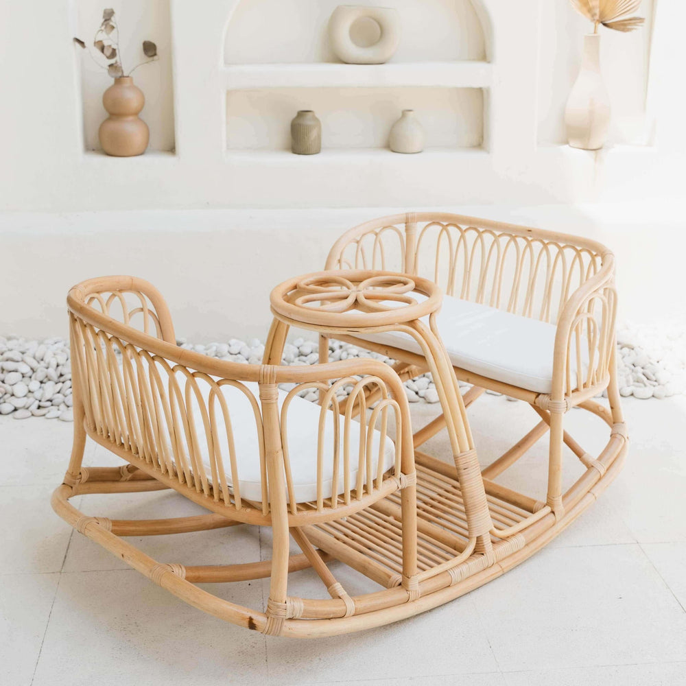 Leon Rocking Bench by MOMIJI with a white cushion, styled in a room with decorative wall accents.