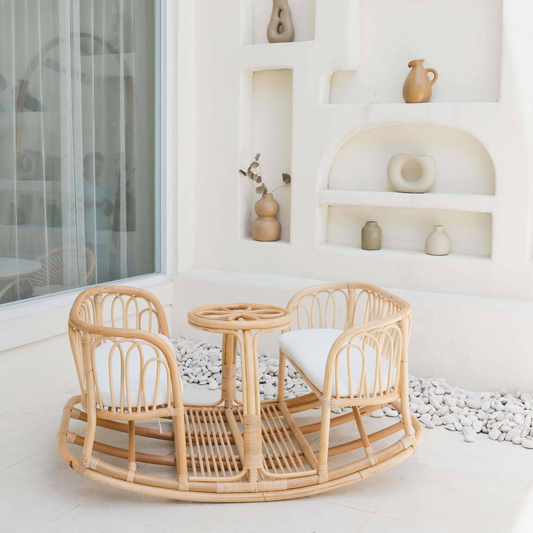 Side view of the Leon Rocking Bench by MOMIJI styled in an indoor setting.