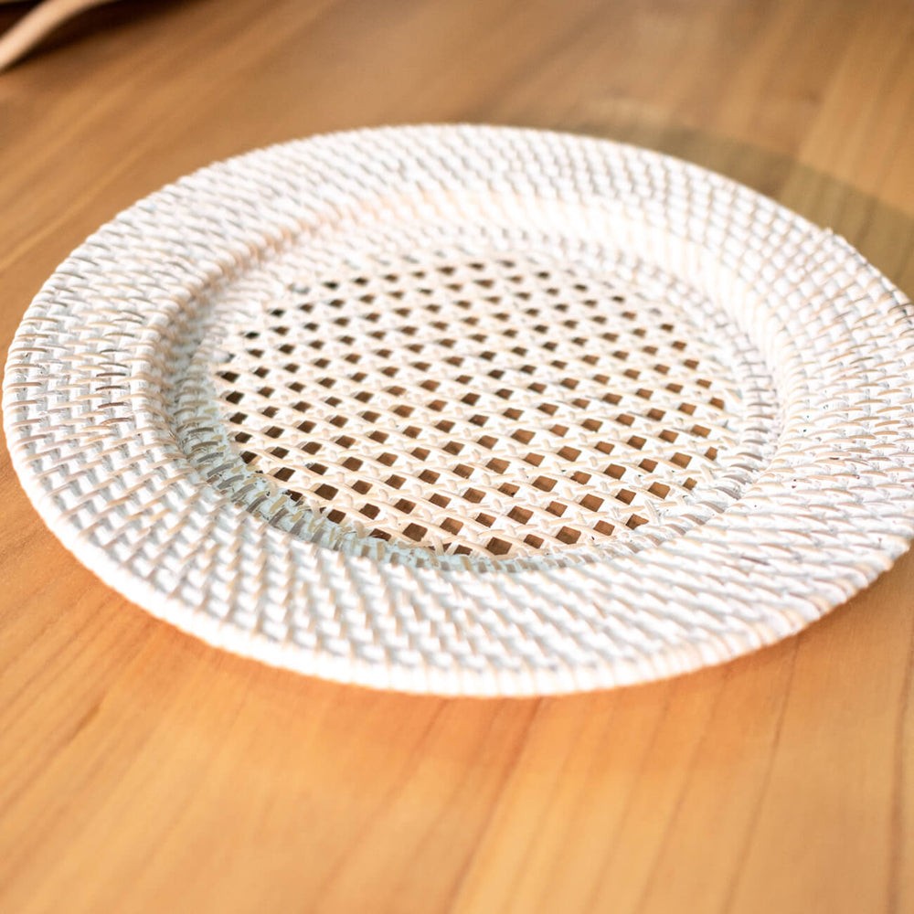 Angled top view of the Lily placemat by MOMIJI showing its woven floral design.