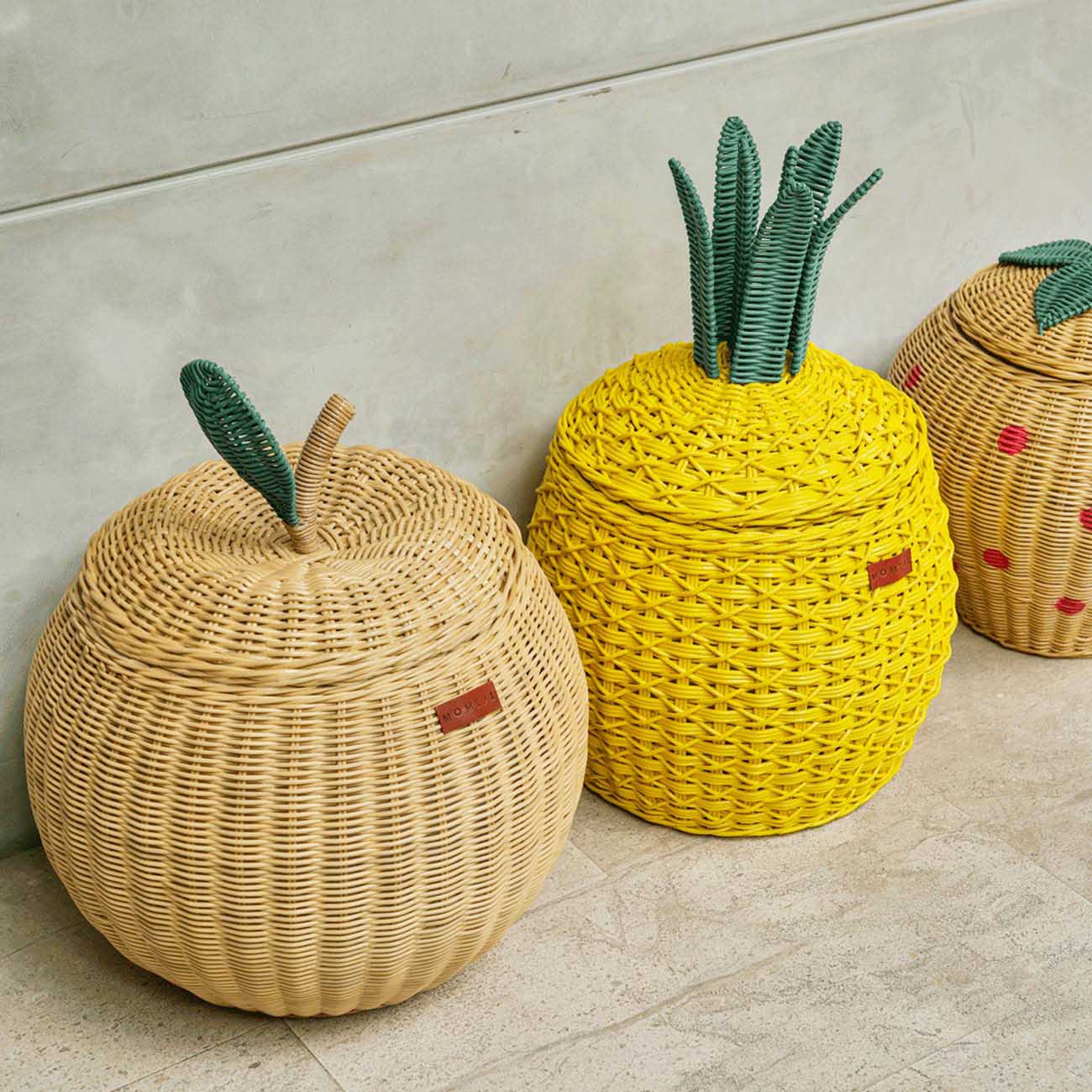 Apple Rattan Storage Basket beside the Strawberry and Yellow Pineapple Rattan Storage Basket.