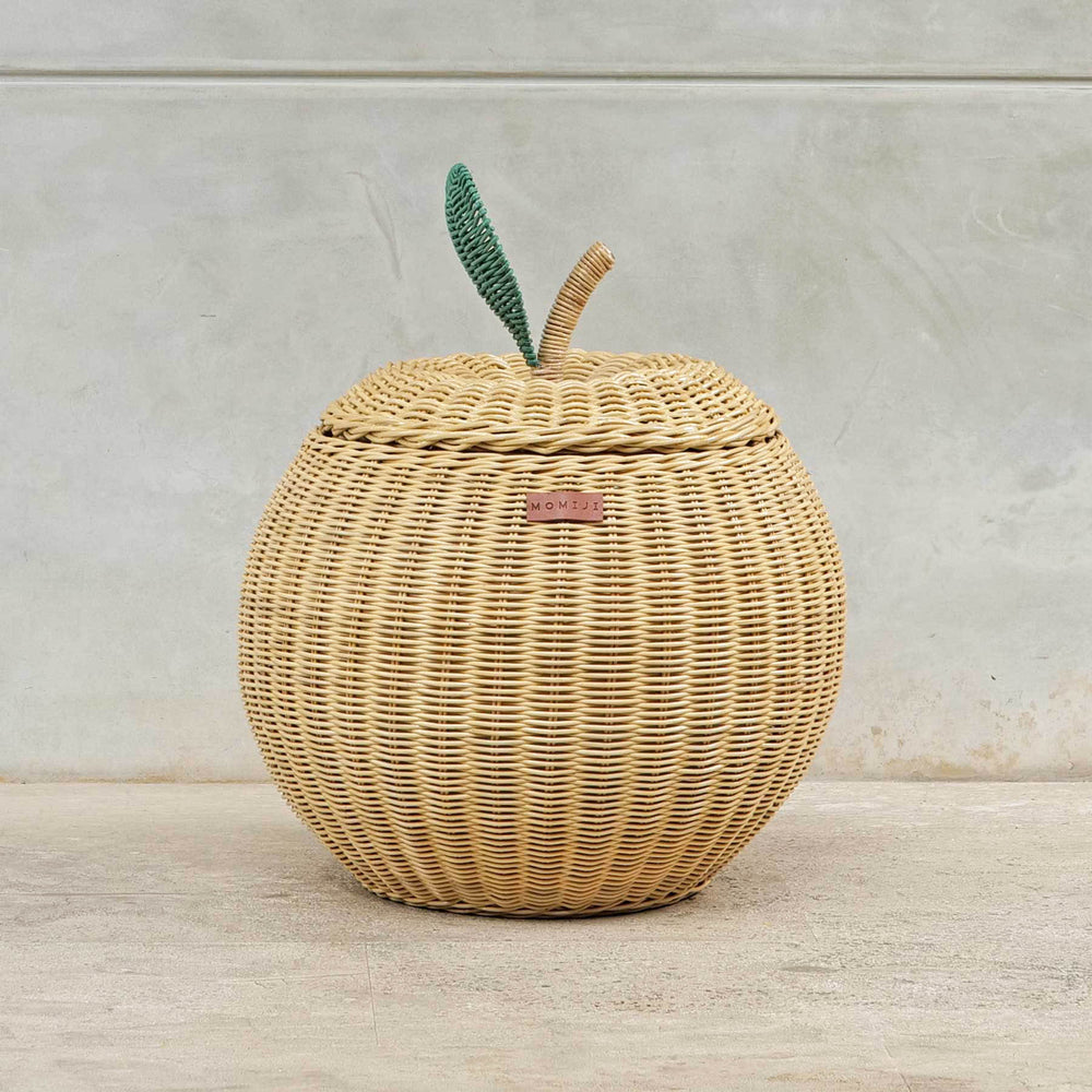 Front view of a medium sized natural apple rattan storage basket by MOMIJI.