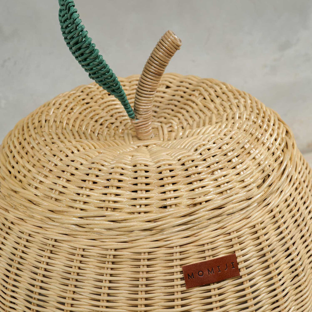Close up view of natural apple rattan storage basket lid by MOMIJI in medium size.