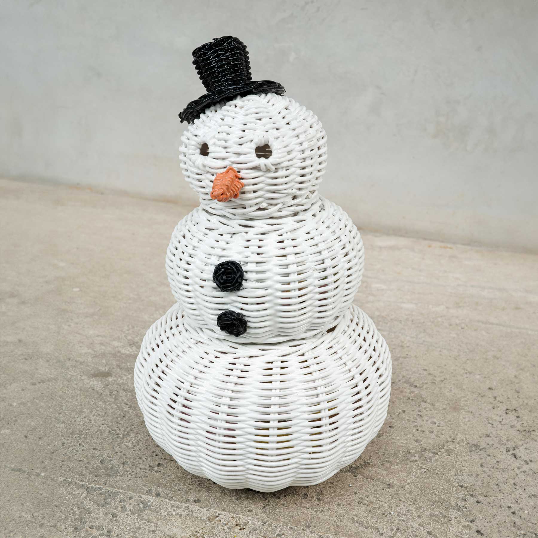 Close up view snowman 3 tier rattan storage basket.