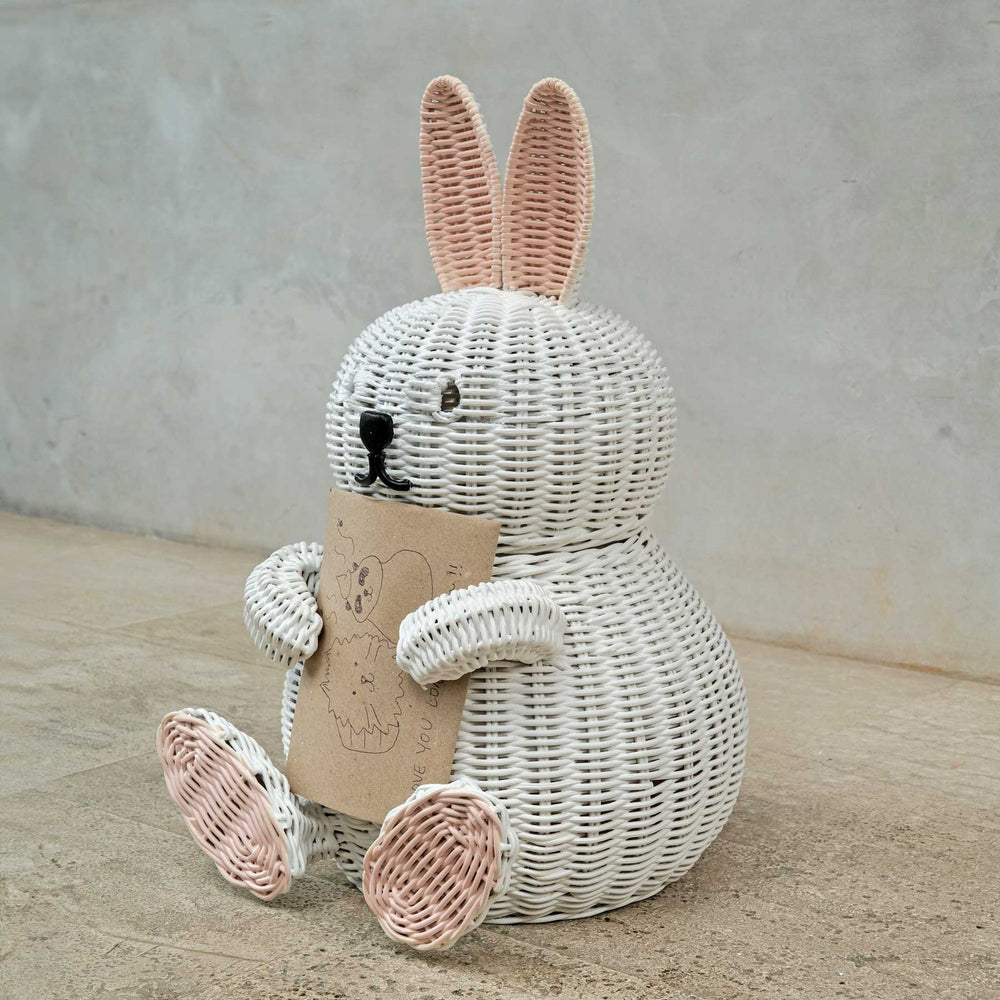 Bunny Rattan Storage Basket by MOMIJI holding a card on a neutral background.