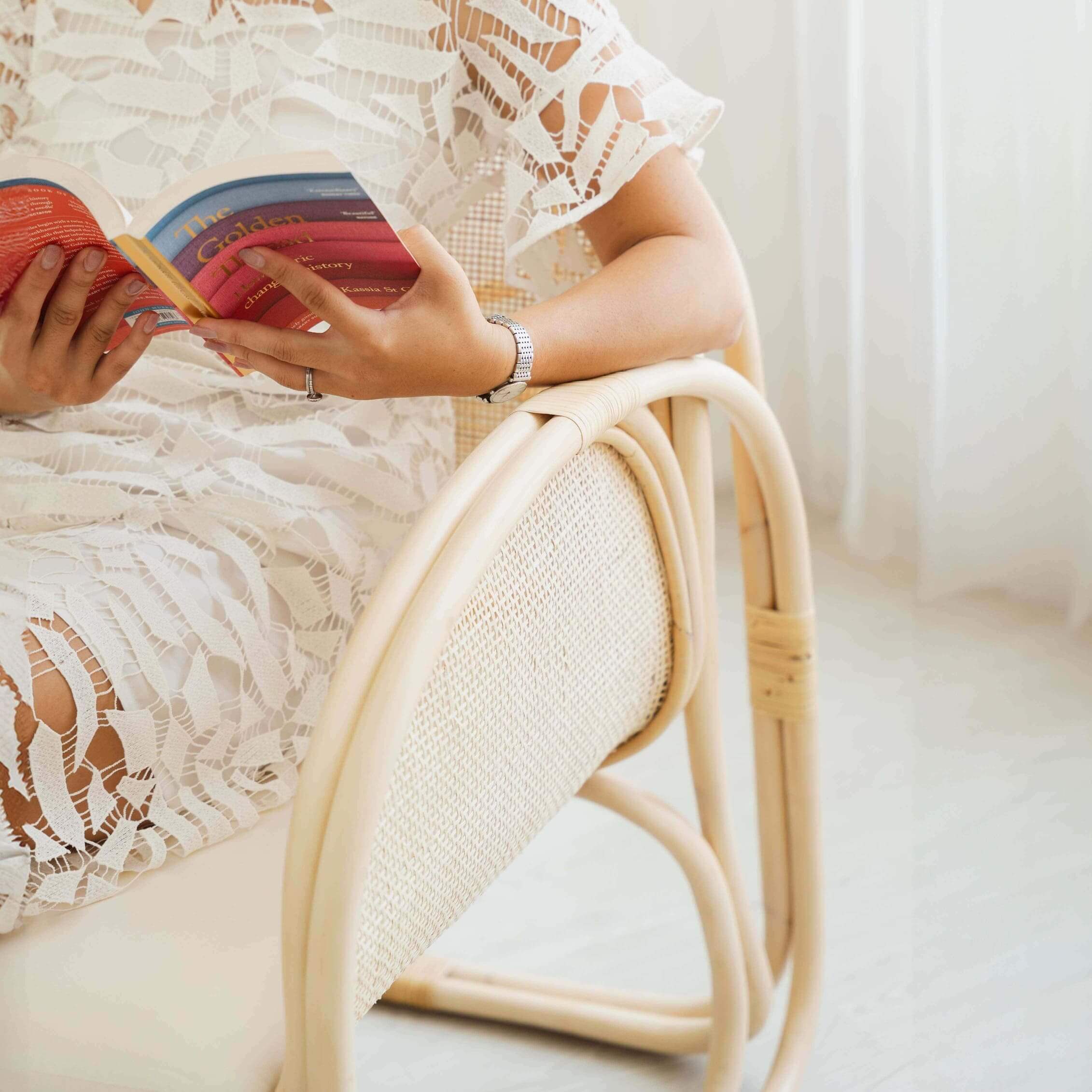 Close-up  of the Willow Lounge Chair by MOMIJI, showcasing its sturdy structure and natural woven texture.
