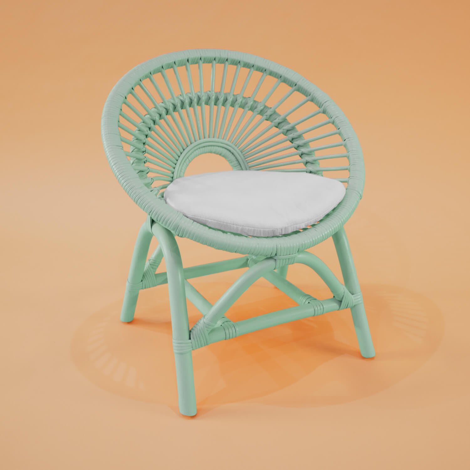 Angled view of the Maya Kids Chair by MOMIJI in mint green.