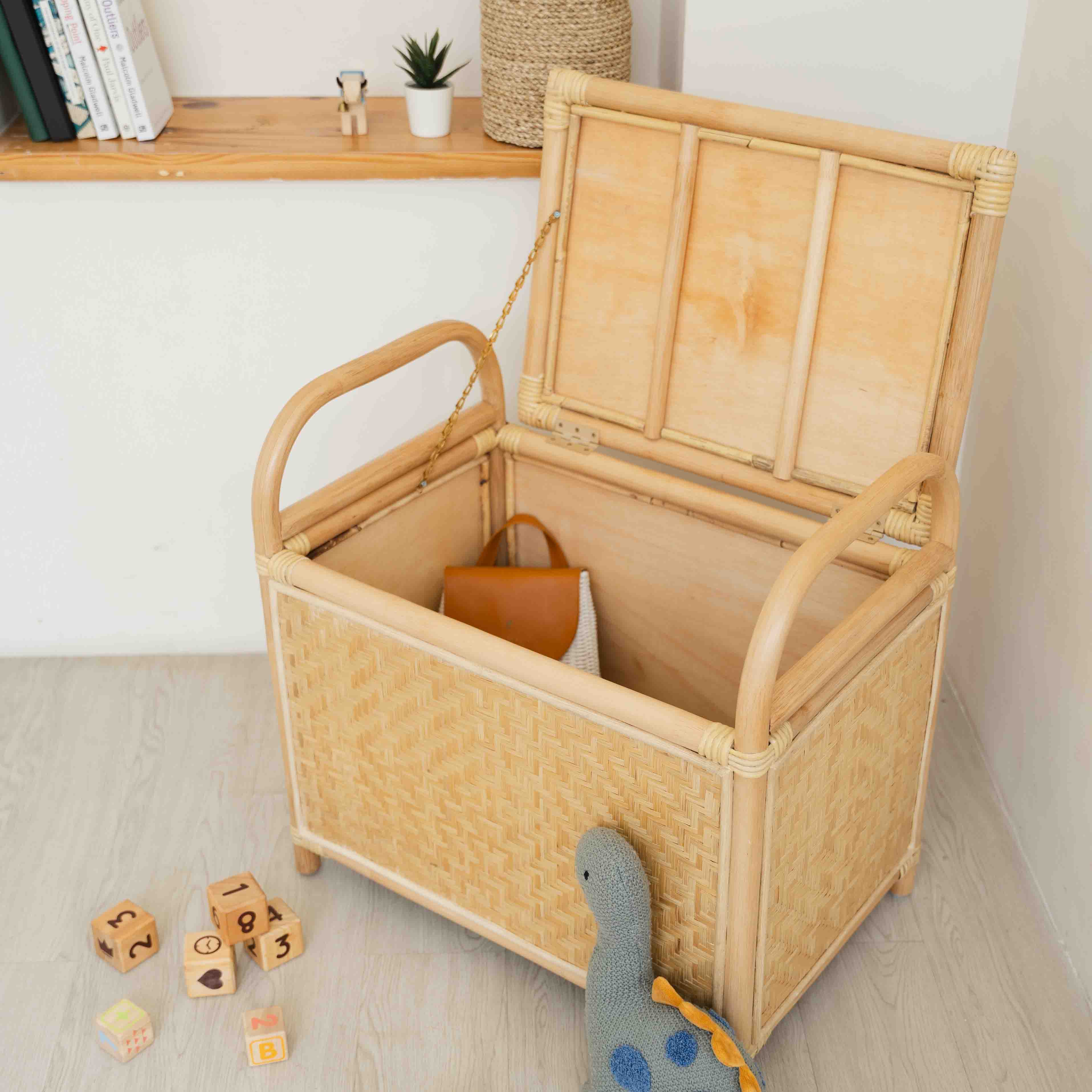 Angled top view of the Mia Storage Bench by MOMIJI opened to reveal interior toy storage.