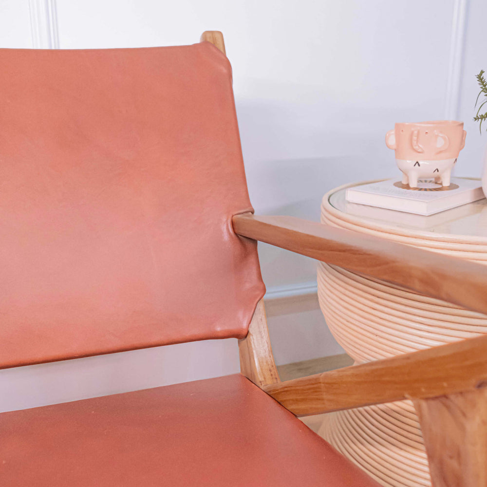 Close-up of the wooden armrest and frame detail of the Monty Leather Lounge Chair by MOMIJI.