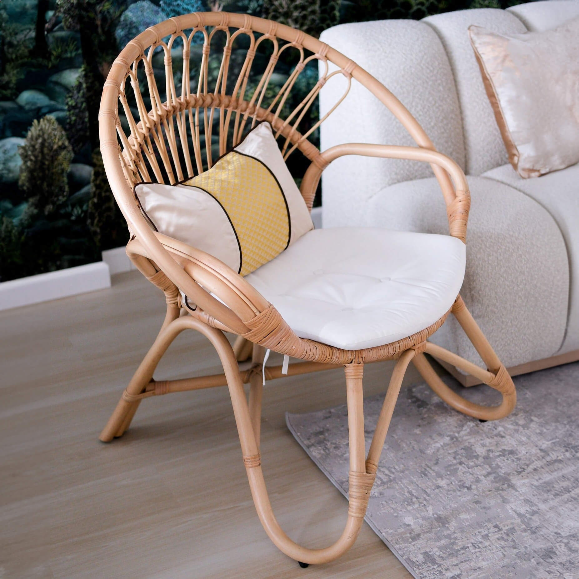 Angled view of the Nest Lounge Chair by MOMIJI in a room with a sofa beside it.