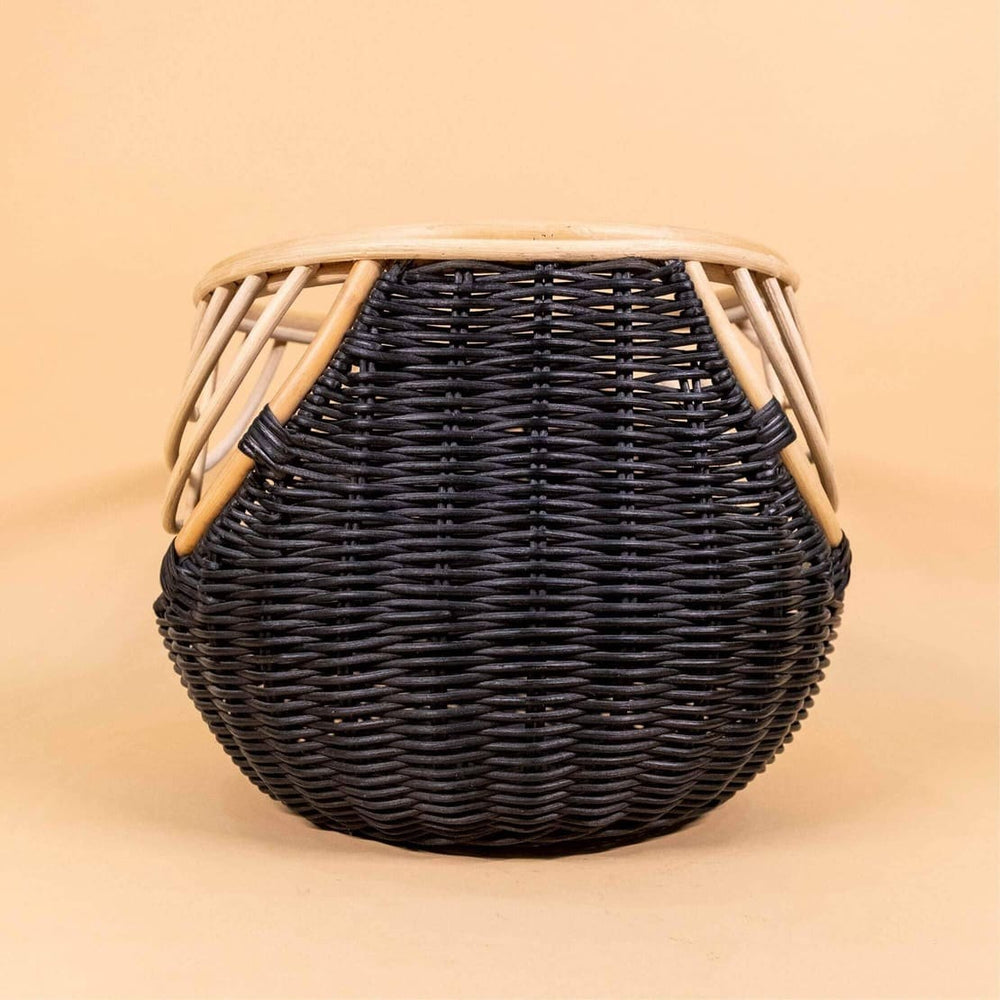 Back view of the handcrafted rattan wicker Nikko Basket by MOMIJI featuring black weaving with natural rattan accents, showing its woven structure.