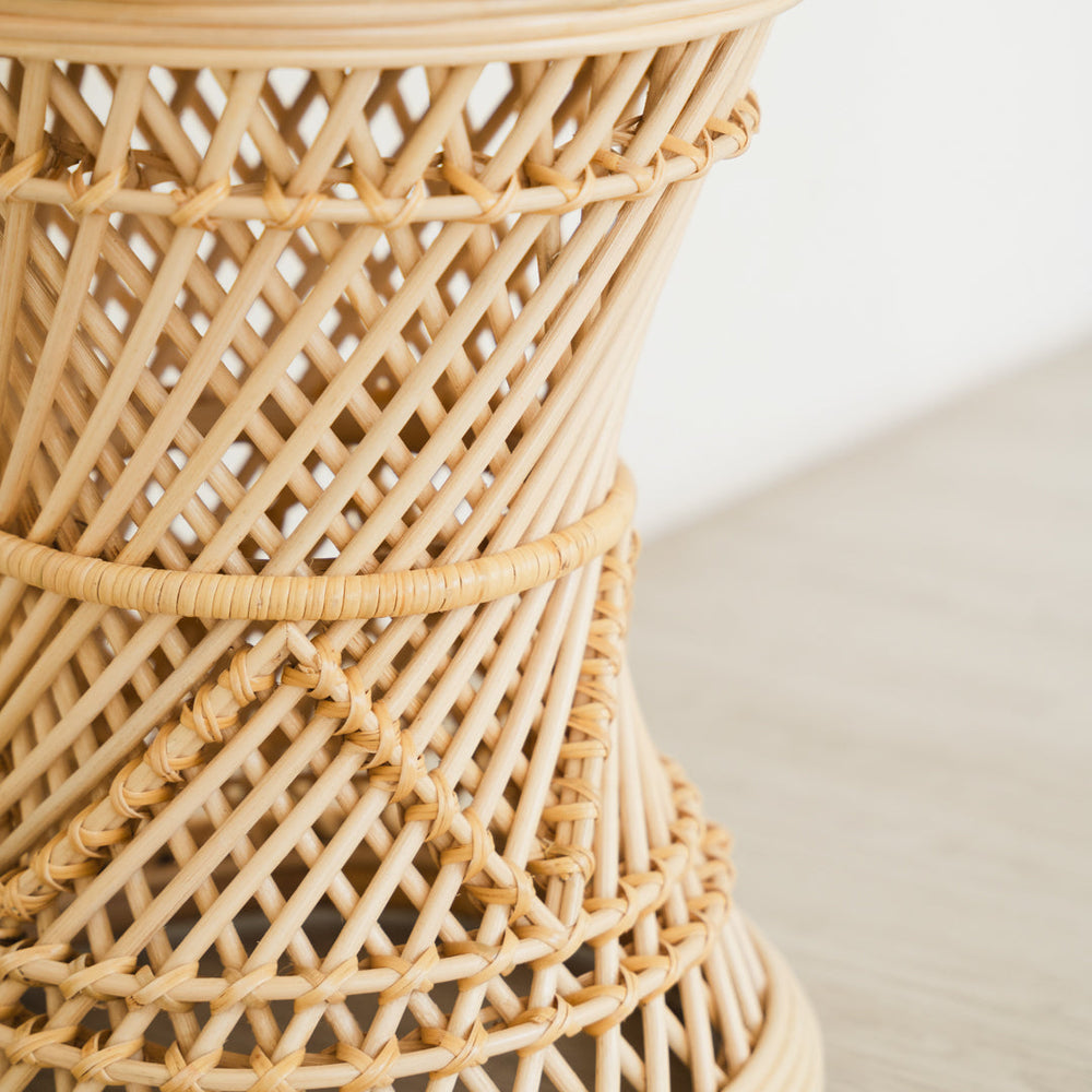 Close-up of the rattan weaving detail of the Palawan Stool by MOMIJI, highlighting its dense structure for strength and durability.