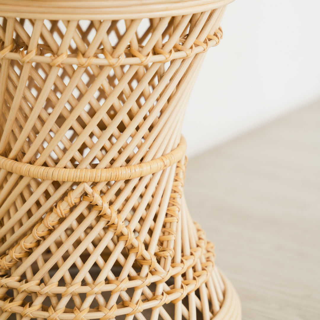 Close-up of the rattan weaving detail of the Palawan Stool by MOMIJI, highlighting its dense structure for strength and durability.