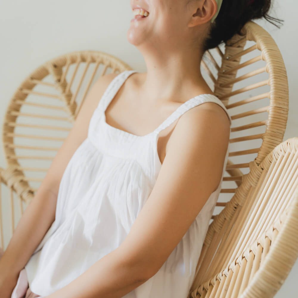 Close-up of the handcrafted rattan petal-shaped design of the Petal Chair by MOMIJI.