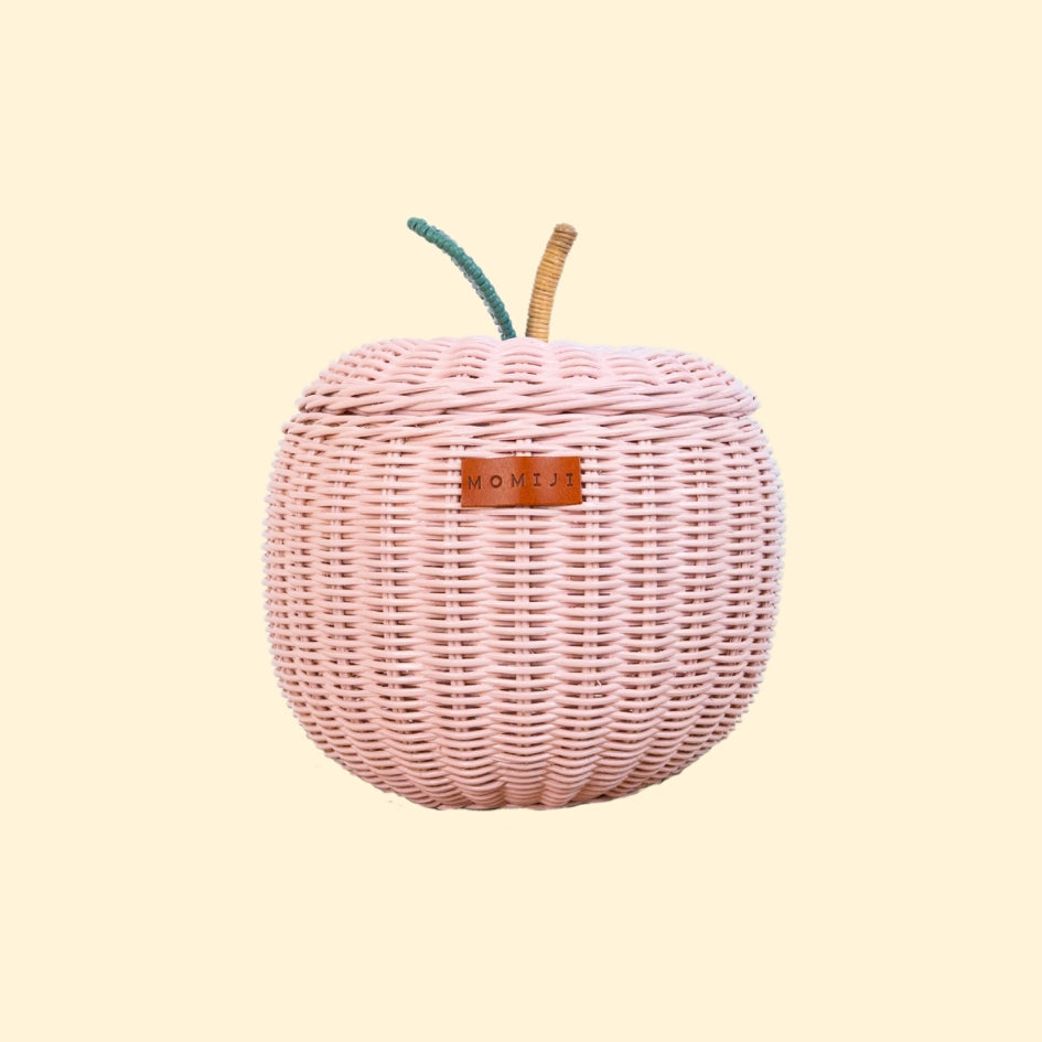 Front view of the Apple Rattan Storage Basket by MOMIJI in pink, small size