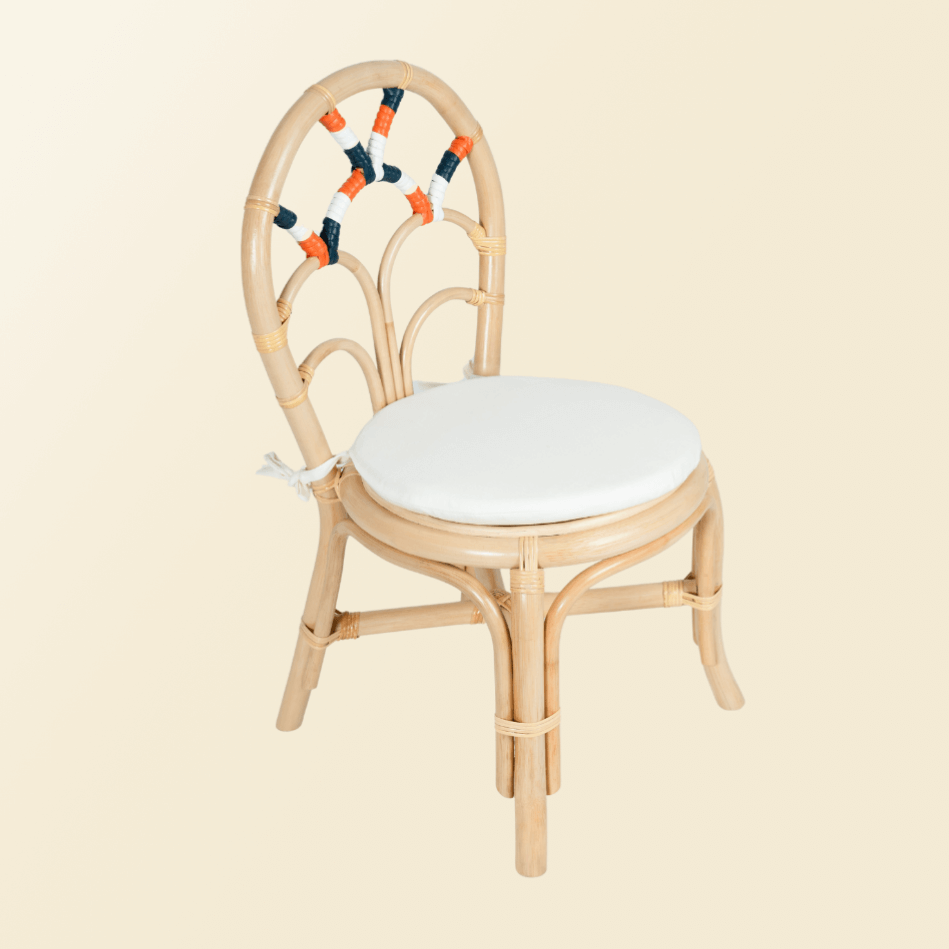 Tilted side of Quentin Chair with white cushion by MOMIJI.