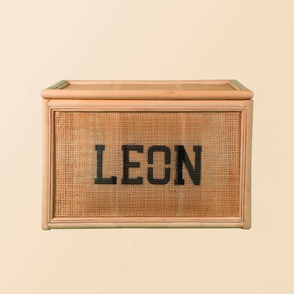 Front view of the Quentin Trunk by MOMIJI showing its woven structure and storage form.