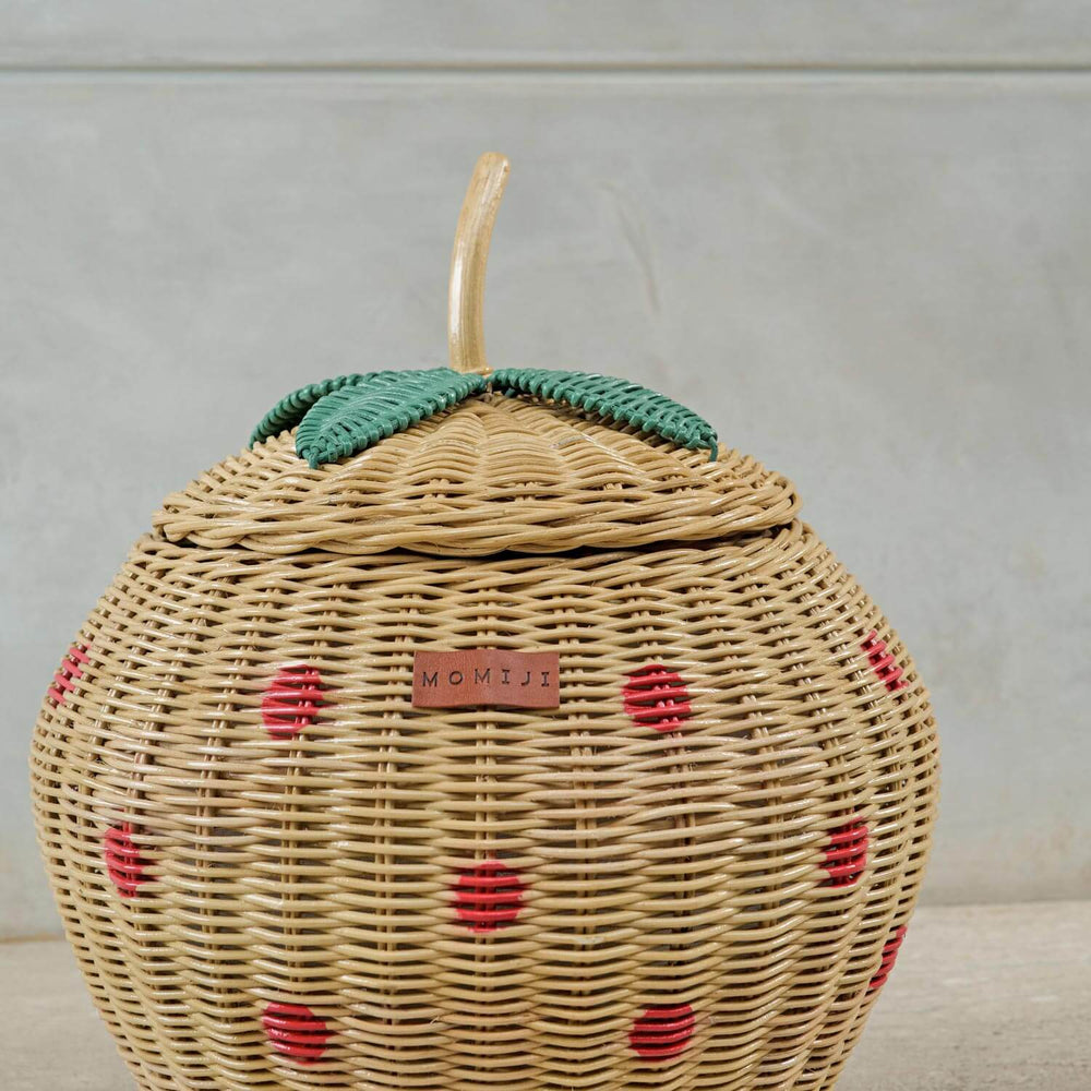 Close up view of MOMIJI logo on Strawberry Rattan Storage Basket.