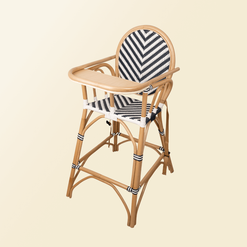 Angled view of the Tumbuh Kids High Chair by MOMIJI with the tray attached.
