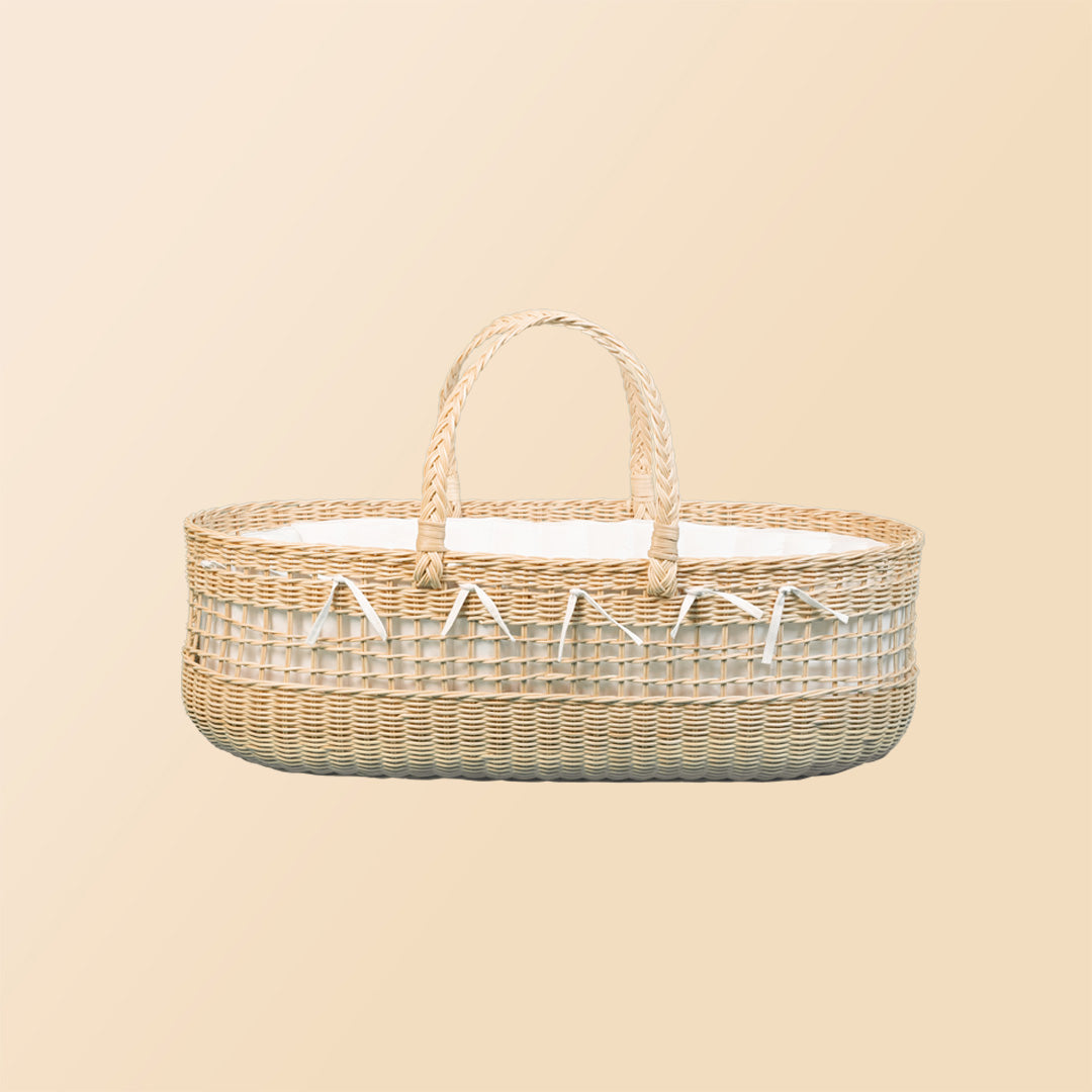 Side view of the Vera Moses Rattan Basket by MOMIJI, highlighting the handwoven rattan pattern throughout the basket.