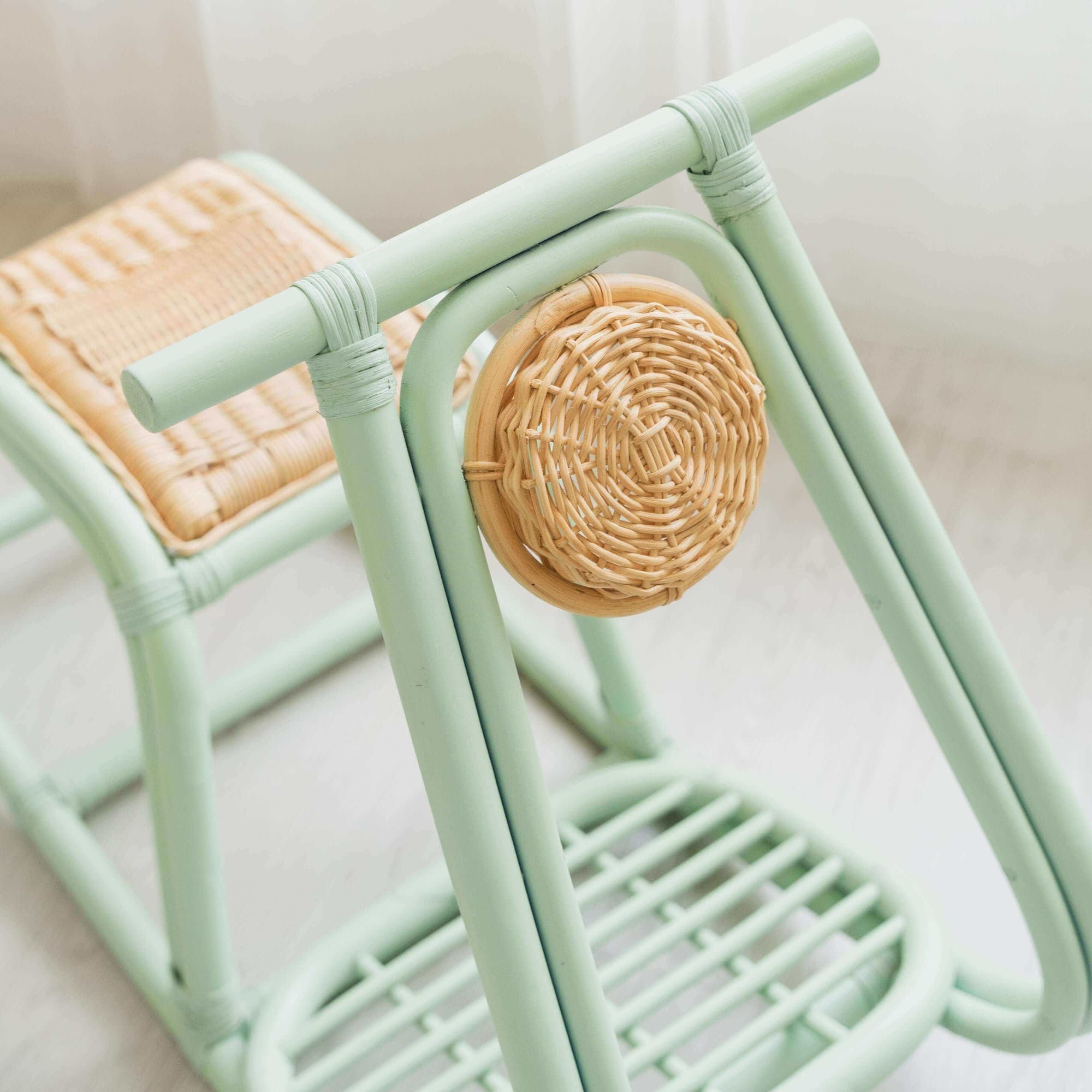 Close-up of the front detail of the Vespa Rocker – Mint by MOMIJI showing the handle, seat, and decorative light design.