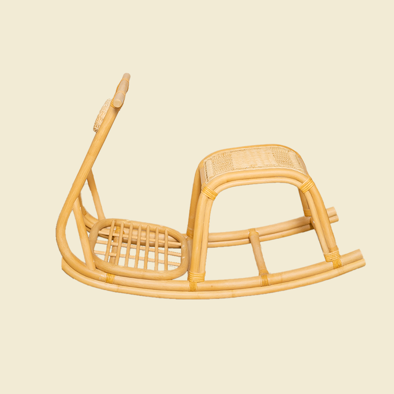 Side view of handcrafted rattan wicker Vespa Rocker by MOMIJI in natural showing its complete structure.