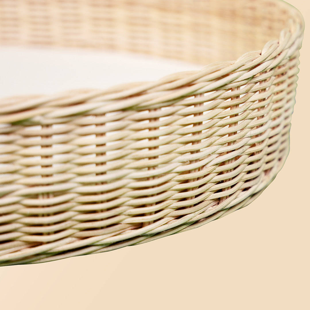 Close-up of the woven rattan detail on the Xander Changing Basket by MOMIJI.