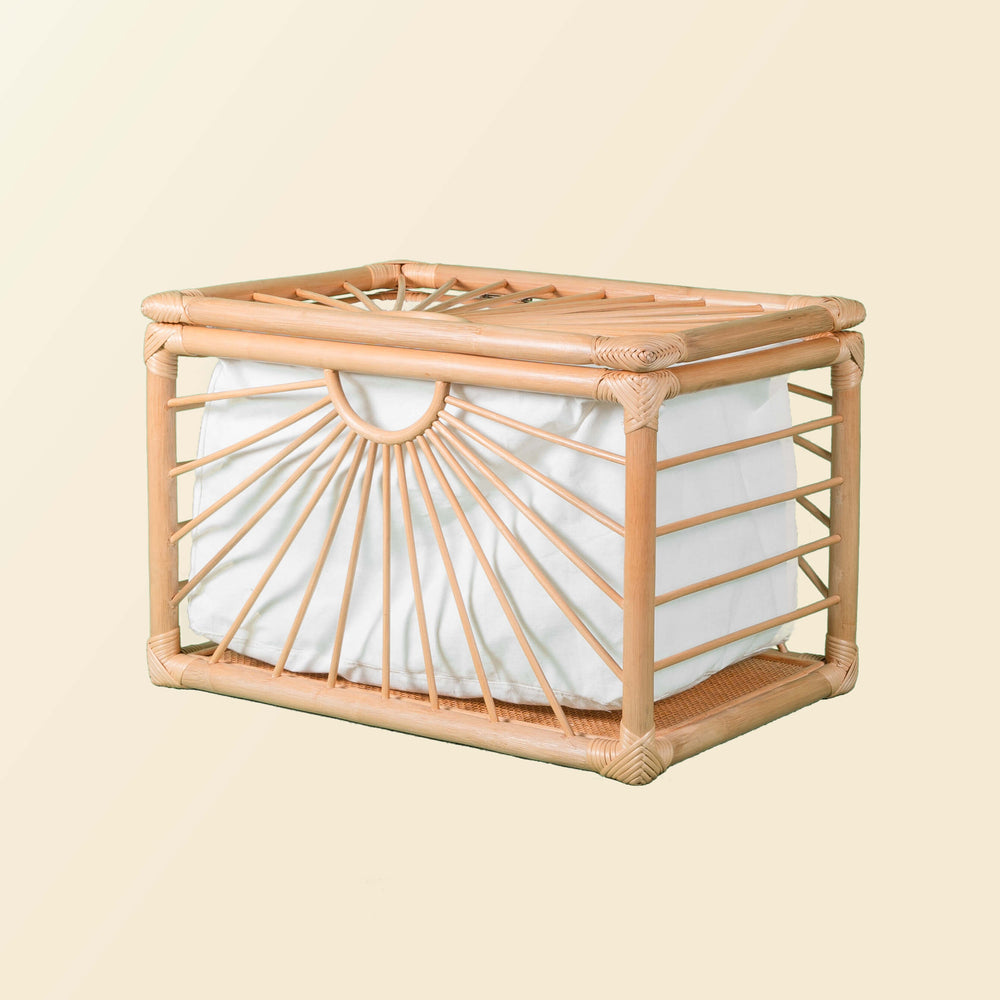 Angled view of the wicker Xander Trunk by MOMIJI highlighting its woven structure.