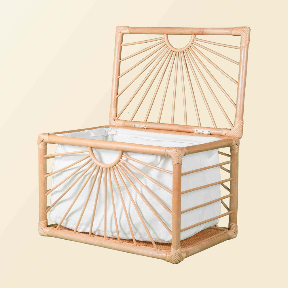 Angled view of the handcrafted wicker Xander Trunk by MOMIJI with the lid open, showing its storage compartment.