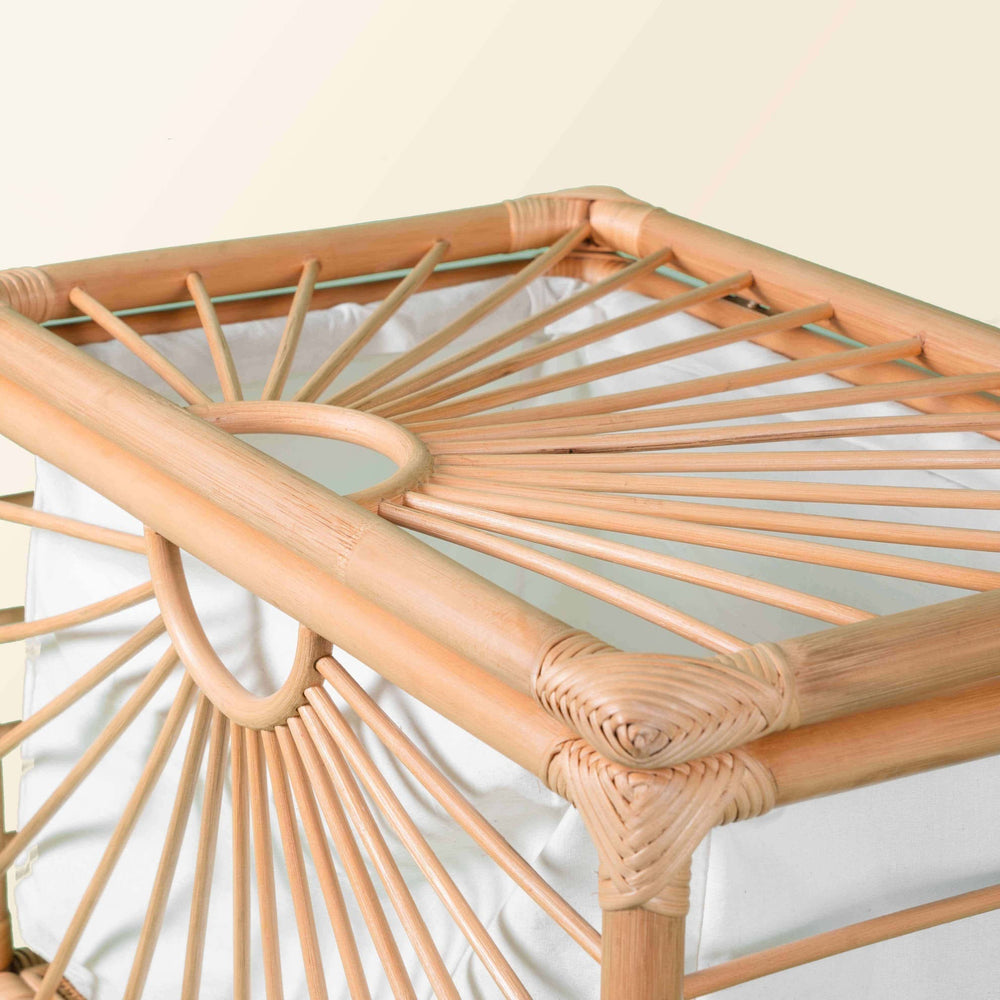 Close-up of the angled side detail of the handcrafted rattan Xander Trunk by MOMIJI.