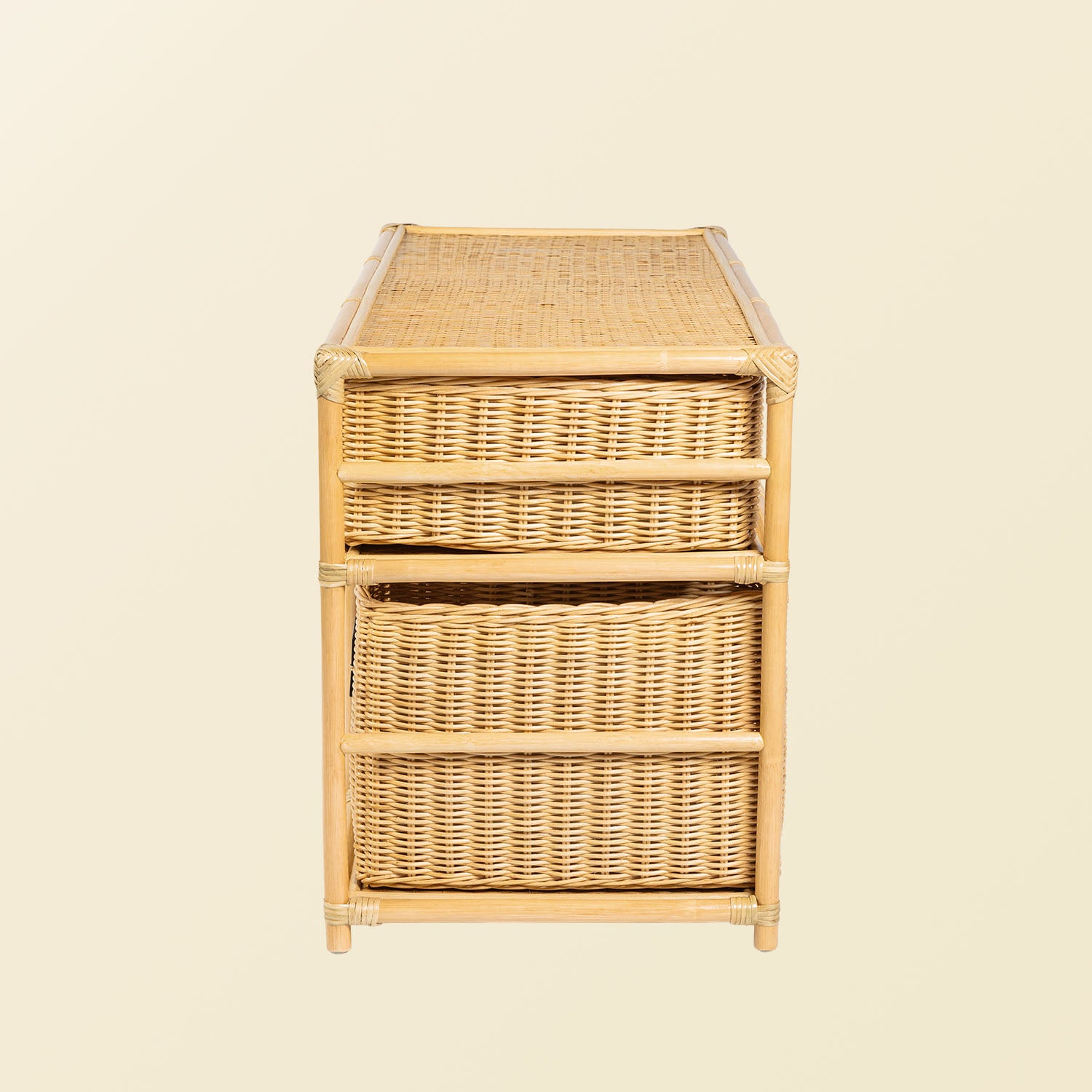 Side view of the Graha Montessori rattan storage shelf by MOMIJI in natural beige, highlighting the woven texture and frame structure.