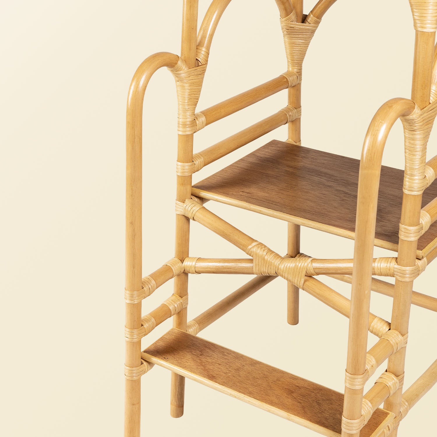 Handcrafted Leon Montessori learning tower by MOMIJI made from rattan, featuring a two-step design, side safety supports, and reinforced wrapped joints.