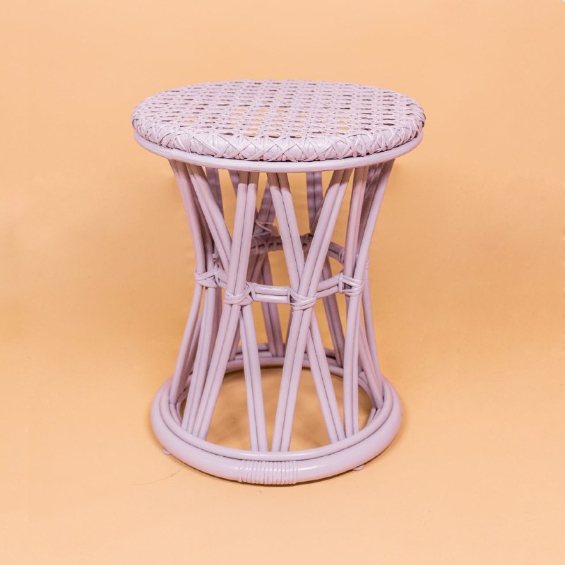 Front view of the lilac Arya Stool by MOMIJI, with the handwoven rattan wicker detailing on the seat. 
